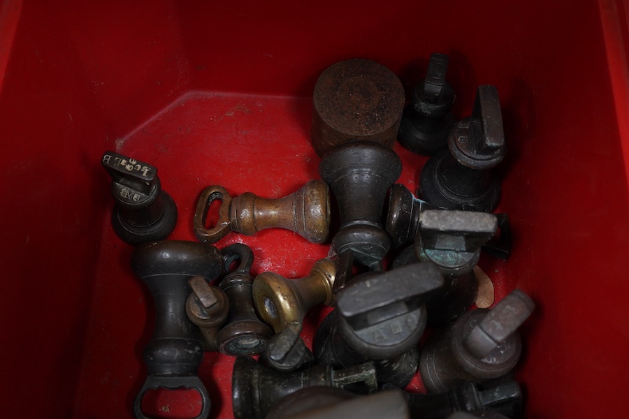 Twenty-four Georgian and later bronze bell weights, largest 7lb, some with Royal Cyphers for George IV, William IV, etc., weight marks, and other proof marks, etc.